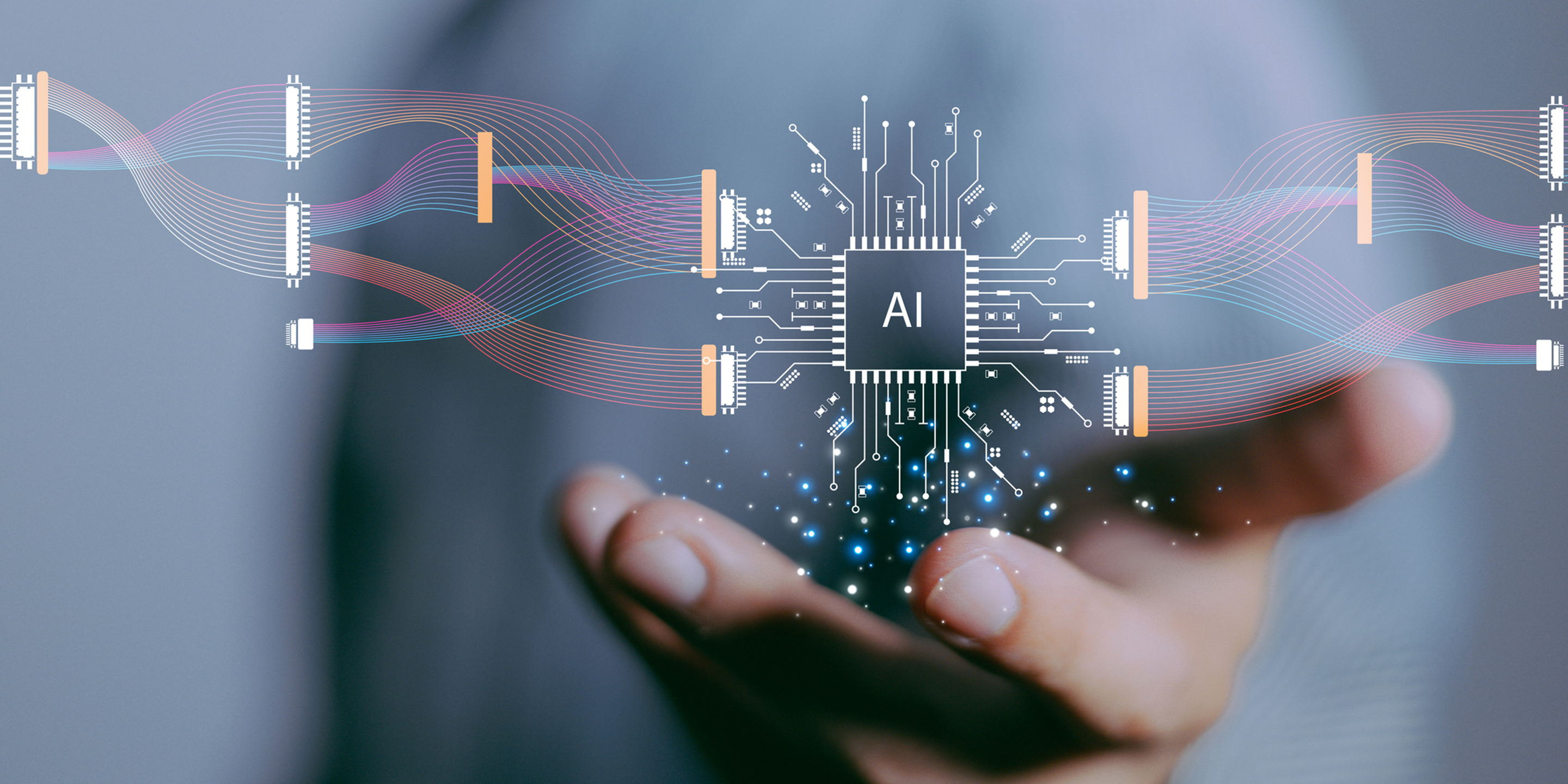 Illustration eines KI-Chips über einer geöffneten Hand, verbunden mit farbigen Datenströmen und Schaltkreisen als Symbol für künstliche Intelligenz und digitale Vernetzung.